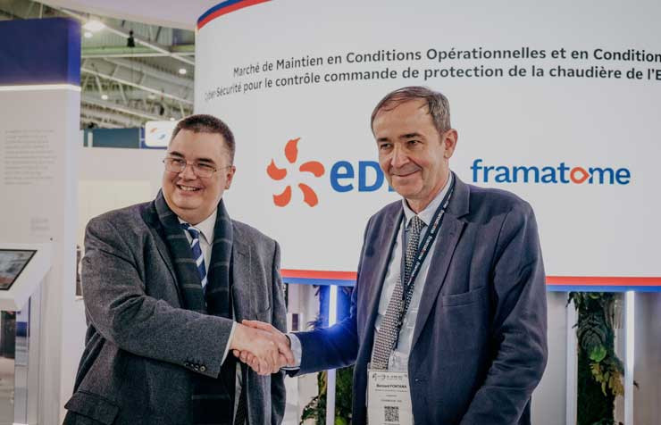 Mr. Cédric Lewandowski, Executive Director of the EDF Group in charge of the nuclear and thermal fleet, and Mr. Bernard Fontana, CEO of FRAMATOME shake hands following the signing of the contract on the EDF stand of the WNE.